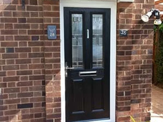 Black composite front door with glazed panels fitted by Secura Windows